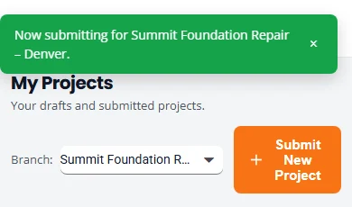 The top of the dashboard after changing branch. A green message reads Now submitting for Summit Foundation Repair, Denver. The Branch selector below it shows a shortened branch name.
